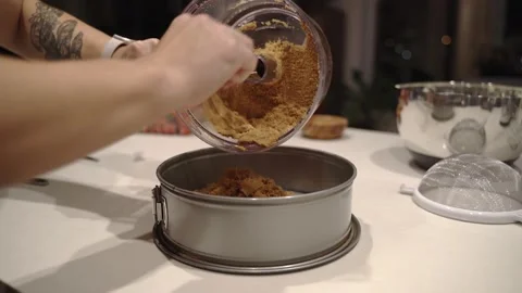 Food processor full of pie crust emptied into springform pan Stock Footage 222166320