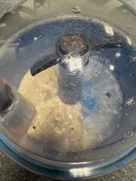 Food processor lid preparing dough in kitchen Stock Photos