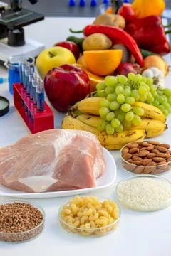 Food Quality Testing: Microscope and Fresh Fruits and Vegetables Stock Photos