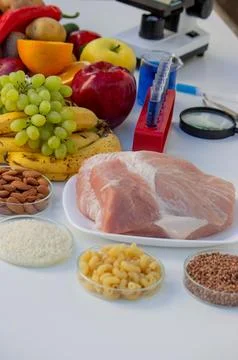 Food Quality Testing: Microscope and Fresh Fruits and Vegetables Stock Photos