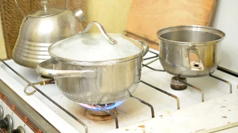 Food (rice) boiling over in stainless steel saucepan Stock Footage 46445865