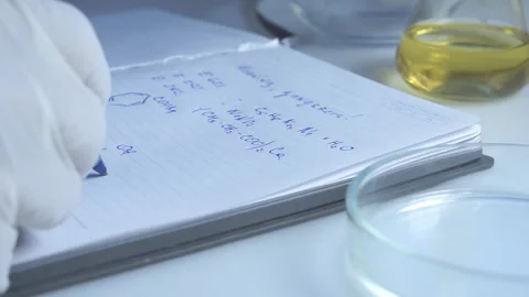 Food safety laboratory, scientist concept. Inspector writing test note on Video stock 142596341