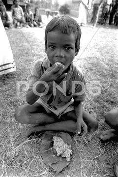 Food school boy eating lunch kunkuri madhyar Stock Photos