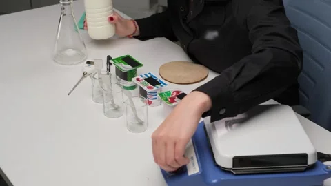 Food Scientist Analyzing Milk in a Lab Stock Footage 306325552