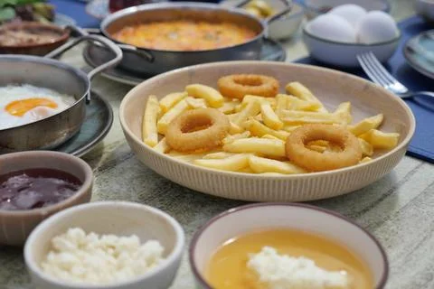 Food served on a table during breakfast at a restaurant Stock Photos