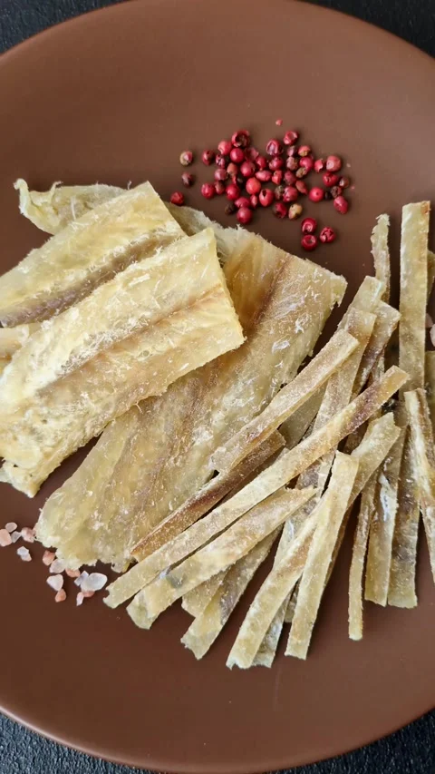 Food, snacks or jerky made from dried dehydrated salted fish with spices. Snacks Stock Footage 311320517