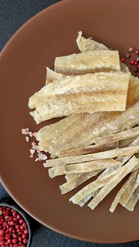 Food, snacks or jerky made from dried dehydrated salted fish with spices. Snacks Stock Footage 311320518