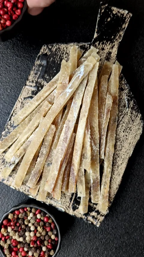 Food, snacks or jerky made from dried dehydrated salted fish with spices. Snacks Stock Footage 311320533