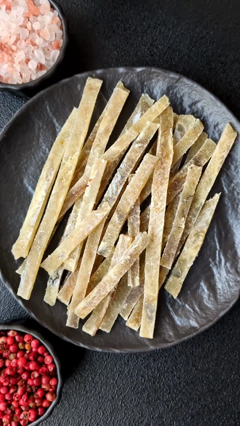 Food, snacks or jerky made from dried dehydrated salted fish with spices. Snacks Stock Footage 311320538