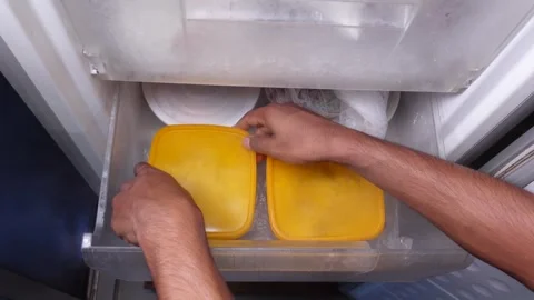 Food storage methods in a refrigerator drawer Stock Footage 345102171