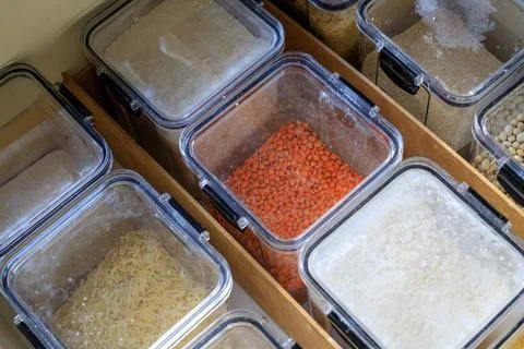 Food  storage system. Clear plastic containers with flour and grains. Stori.. Stock Photos