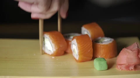 Food, sushi rolls: Someone eats sushi rolls. Close up Stock Footage 62586077
