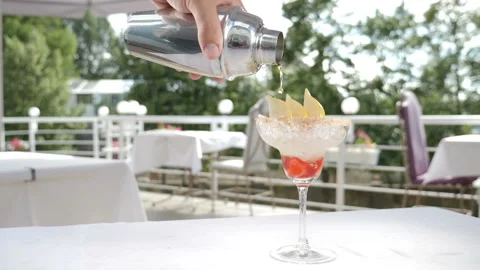Food video in slow motion. Process of serving summer fruit cocktail on open Stock Footage 111413220