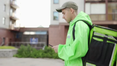 Foof courier using navigation app Stock Footage 113990323