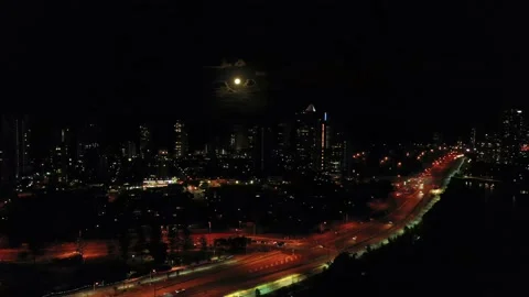Fool Moon over the Gold Coast, Illuminated clouds, Busy highway Stock Footage 138062395