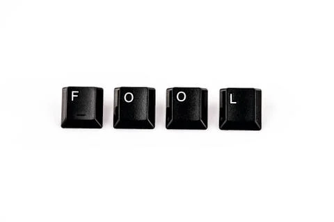 Fool word written with black computer buttons over white Stock Photos