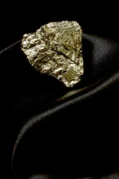 Fools gold on satin Stock Photos