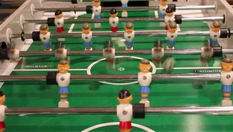 Foosball serve and player kicks ball Stock Footage 225379280