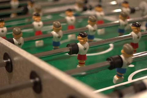 Foosball table player side view Stock Photos