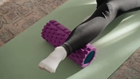 Foot and ankle mobility routine. Using foam roller for foot recovery process Stock Footage 342423453