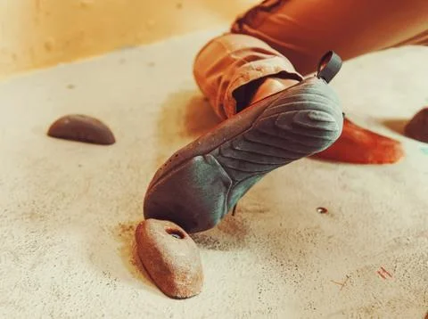 Foot on artificial boulder, close-up Stock Photos