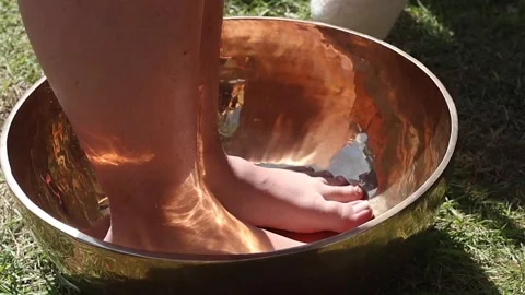 Foot Bath in Copper singing Bowl Stock Footage 284108183