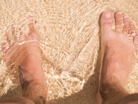 Foot on the beach Stock Photos