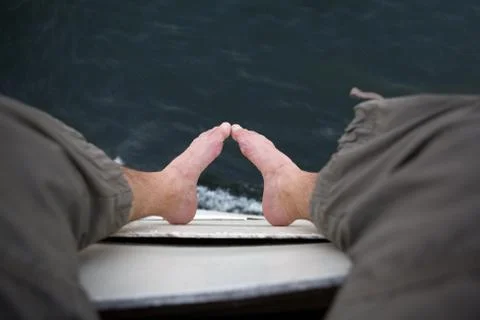 Foot on board Stock Photos