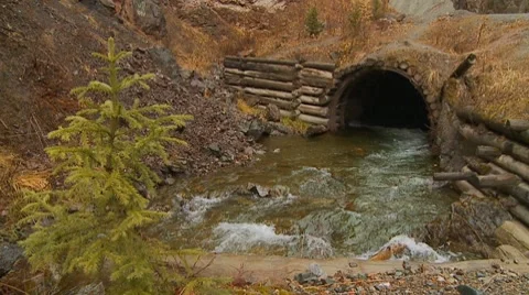 Foot bridge across mountain stream, Stock Footage 7736999