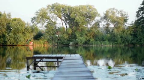 Foot Bridge on the lake Stock Footage 53548028
