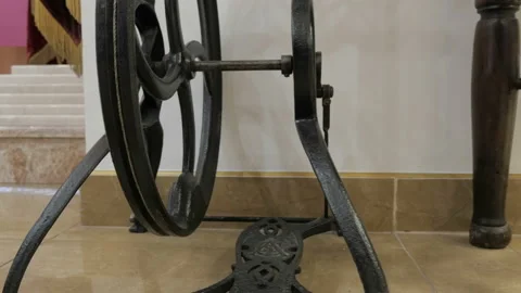 The foot control with rotate wheel on retro equipment. Mechanical drive pedal Stock Footage 90352304
