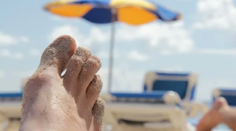 Foot covered in sand. Video stock 8653544