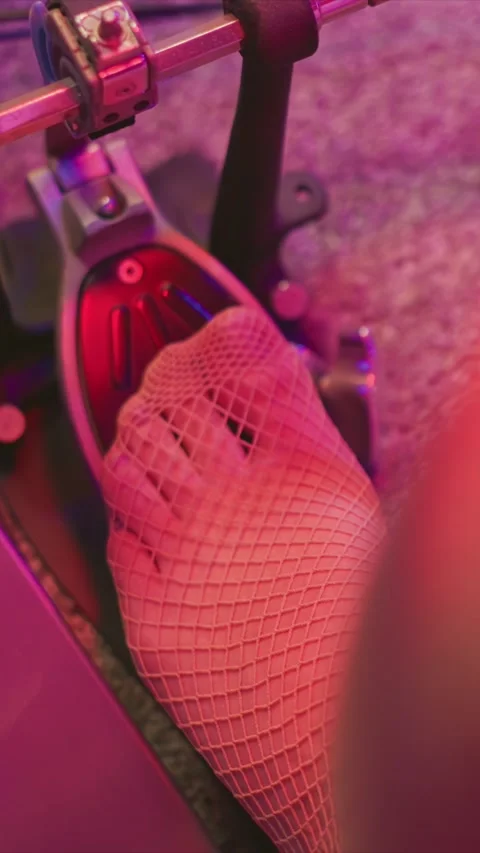 Foot In Fishnet Stocking Pressing Drum Pedal Under Pink Purple Stage Lighting Stock Footage 345986800