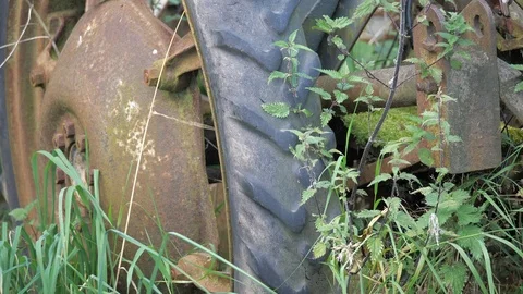 Foot kicks tractor tyre Stock Footage 116106088