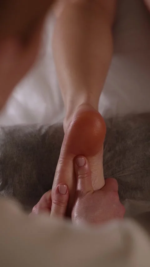 Foot massage session in a quiet room during daytime Stock Footage 341281702
