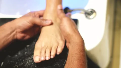 Foot Massage Therapy with Selective Focus  Spa Relaxation Concept Stock Footage 325528917