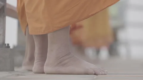 Foot of monk when they standing and blessing Stock Footage 65107004