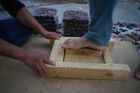 Foot placement on wooden support in workshop Stock Photos