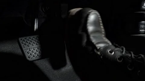 Foot pressing Accelerate and Brake foot pedal of a car to drive ahead. Stock Footage 232201501
