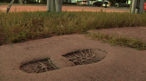 Foot Print In Concrete Stock Footage