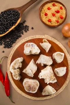 Foot raw pork on wooden background Stock Photos