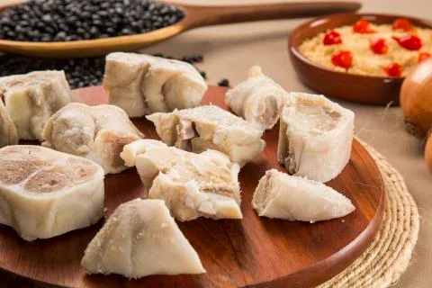 Foot raw pork on wooden background Stock Photos