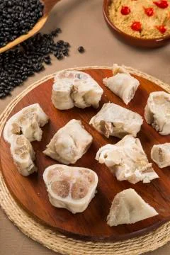 Foot raw pork on wooden background Stock Photos