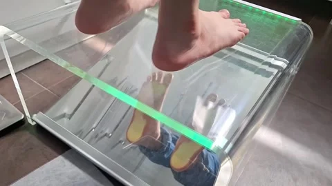 Foot reflection study in modern glass display for podiatry and design insights Stock Footage 287917548