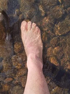 Foot in the river Stock Photos