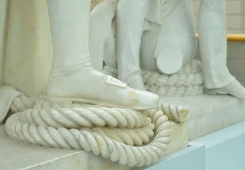 Foot on rope statue Stock Photos