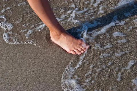Foot on the sand. Stock Photos
