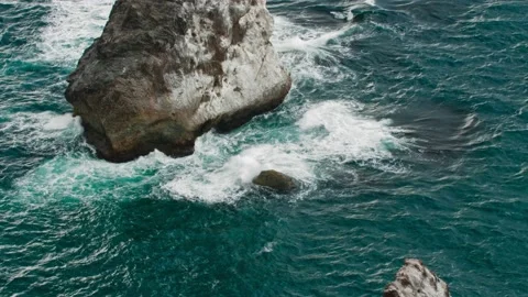 The foot of the sea reef, on which the waves break. Long shot taken with a Stock Footage 218405522
