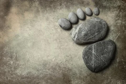 Foot shape by stone Stock Photos