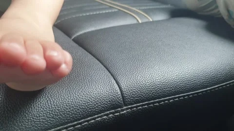 Foot of a small kid in car Stock-Footage 281938023